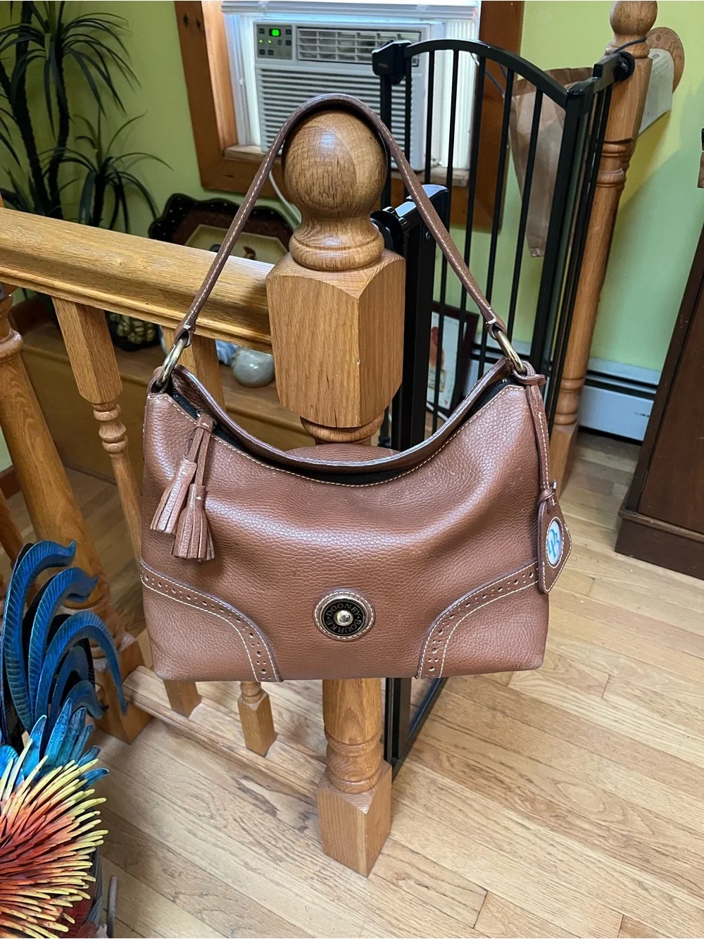 Dooney & Bourke Camel Brown Pebbled Leather Shoulder Bag with Tassel Emblem
